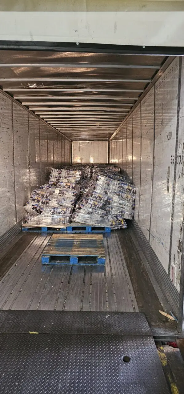 A truck full of meat is packed and ready to be shipped.